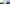 Panoramaaufnahme: Bauleiter steht lächelnd vor Photovoltaikanlage und Windrädern auf einer Wiese.